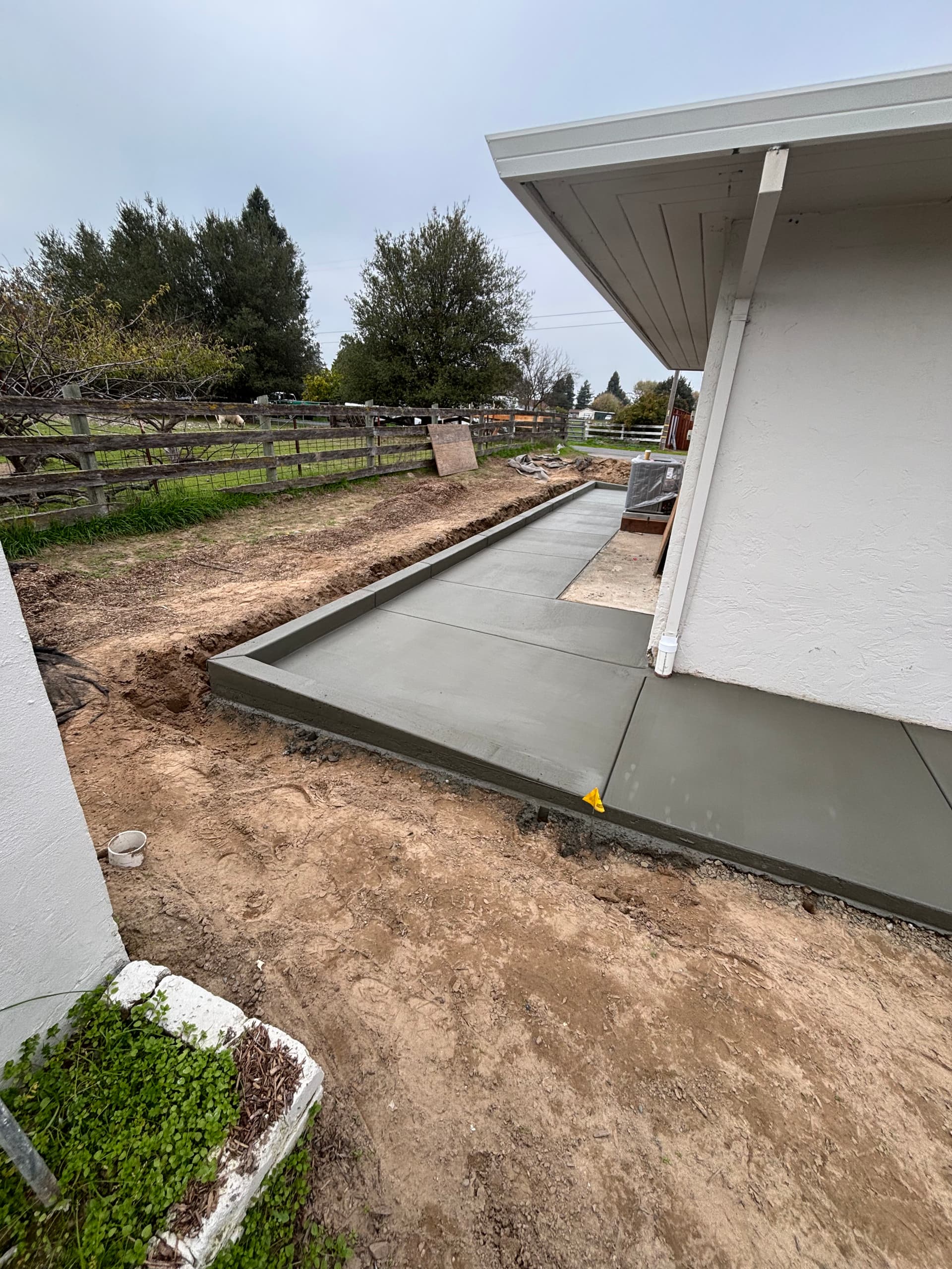 New Driveway and Walkways Installation at Residential Home